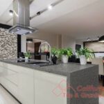 Designed kitchen with stone wall